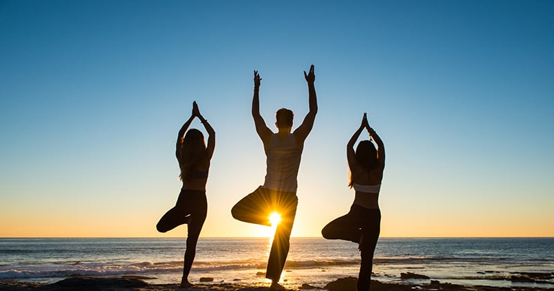 People practicing yoga on La Jolla, CA